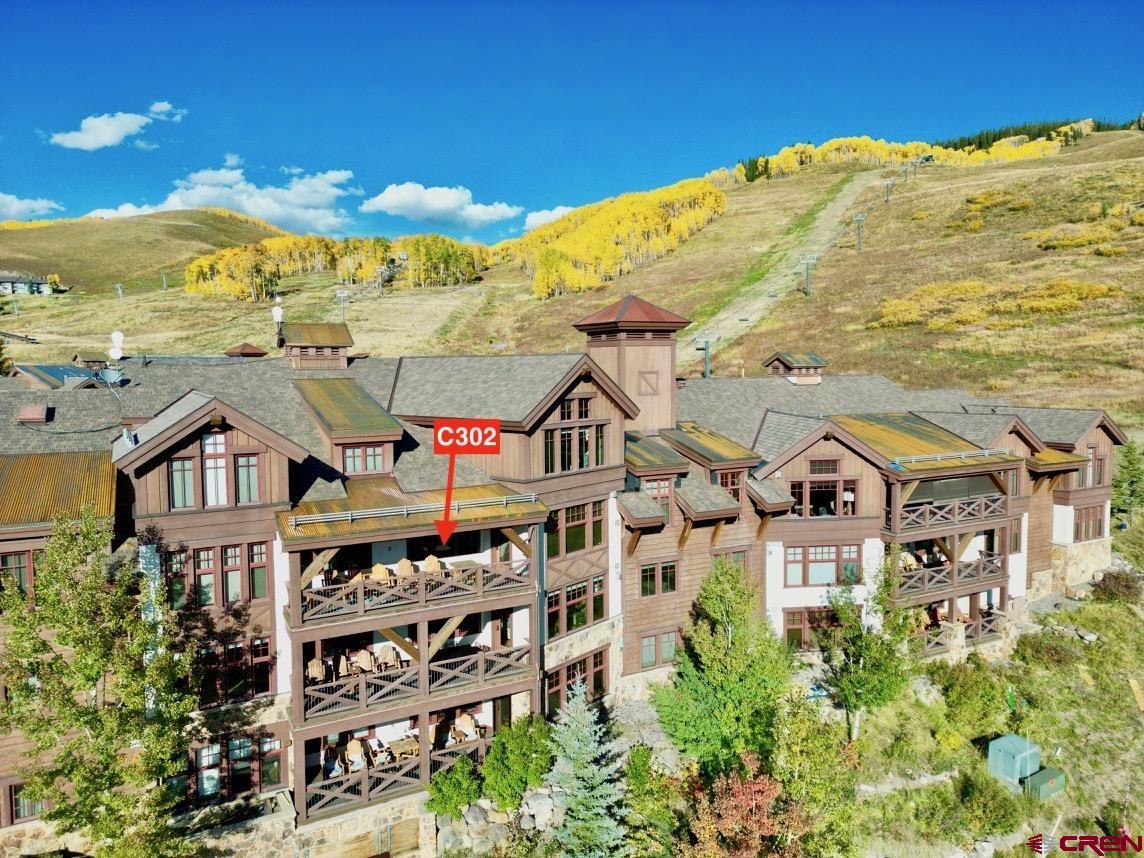 14 Hunter Hill Road, Unit C302 Crested Butte, CO 81225 - Photo 3 of 32 a large building with a view of a city