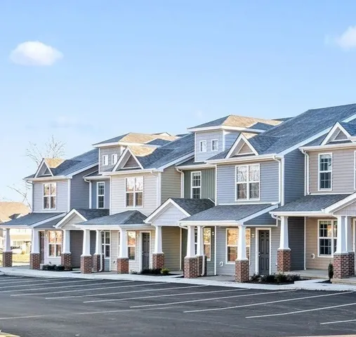 a front view of a residential houses with a street