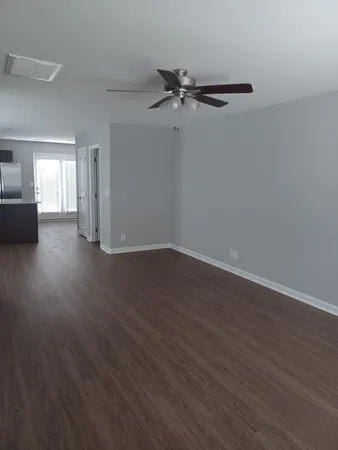 a view of a livingroom with wooden floor