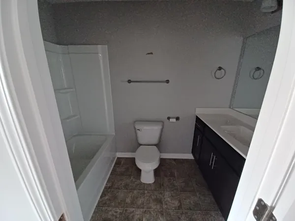 a bathroom with a toilet and a sink