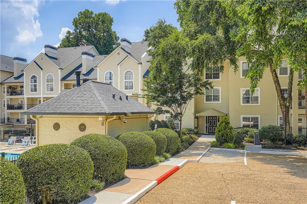 a aerial view of a house with a yard and potted plants