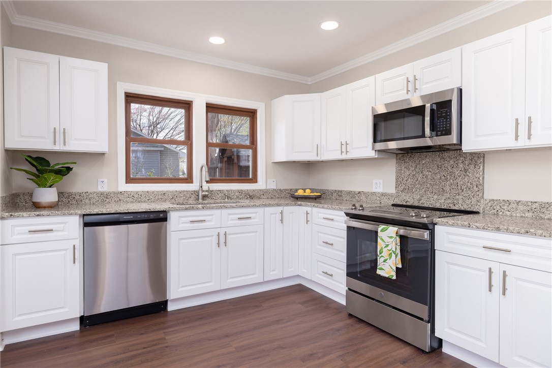 204 Old Salem Road Seneca, SC 29672 - Photo 10 of 28 This renovated kitchen features granite counters, stainless steel appliances, and sleek wood flooring.