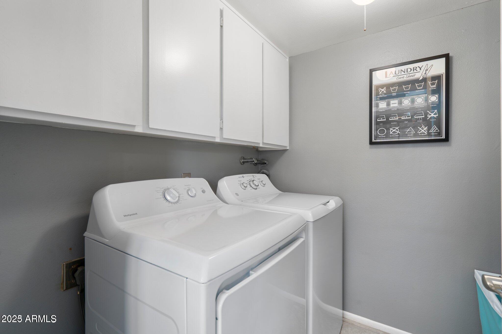 6921 East Osborn Road, Unit D Scottsdale, AZ 85251 - Photo 8 of 14 a utility room with dryer and washer