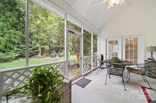 a building outdoor space with patio furniture and garden