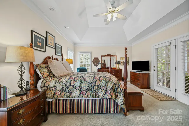 a bedroom with a bed and a television