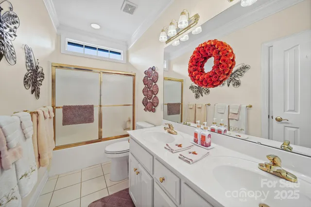 a bathroom with a sink mirror and toilet