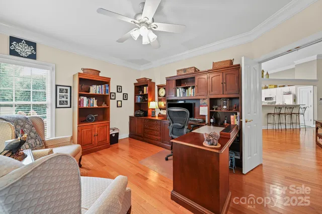 a living room with furniture a rug and a flat screen tv