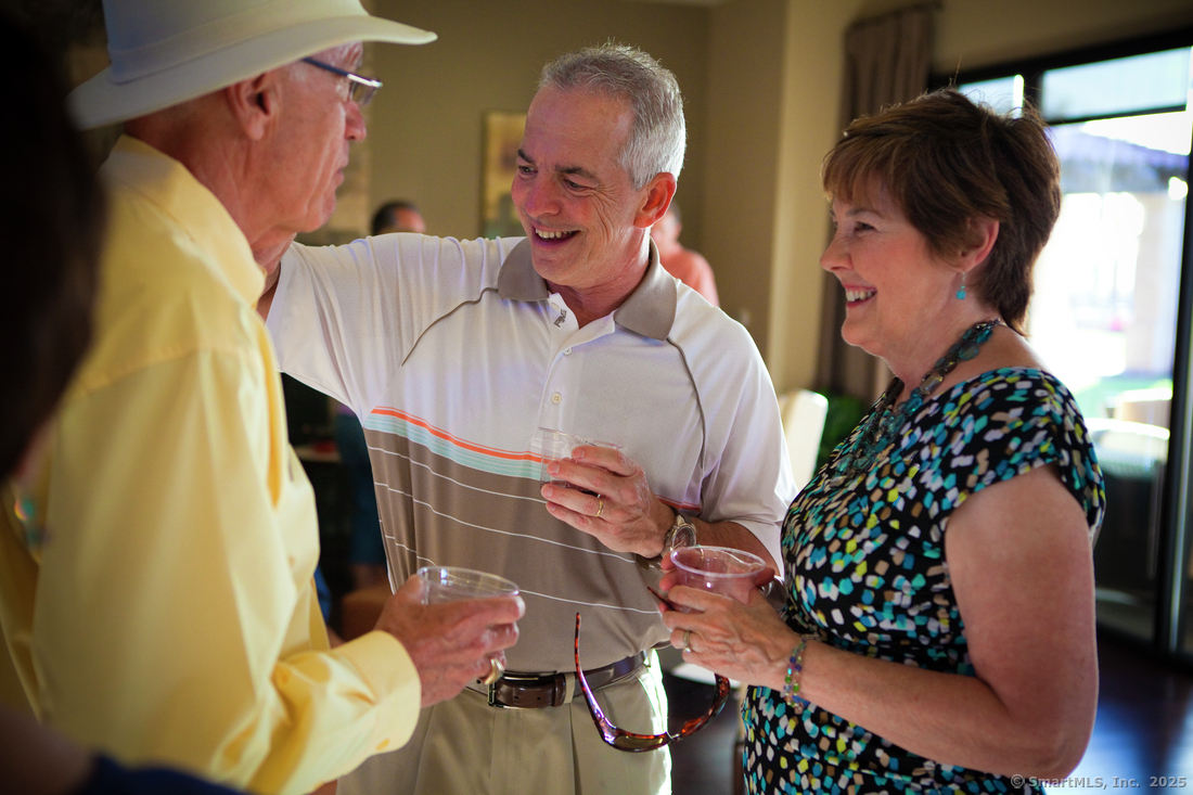 14 Whisper Rdg Way, Unit 46 Woodbridge, CT 06525 - Photo 12 of 14 a bedroom with two large bed and a painting on the wall
