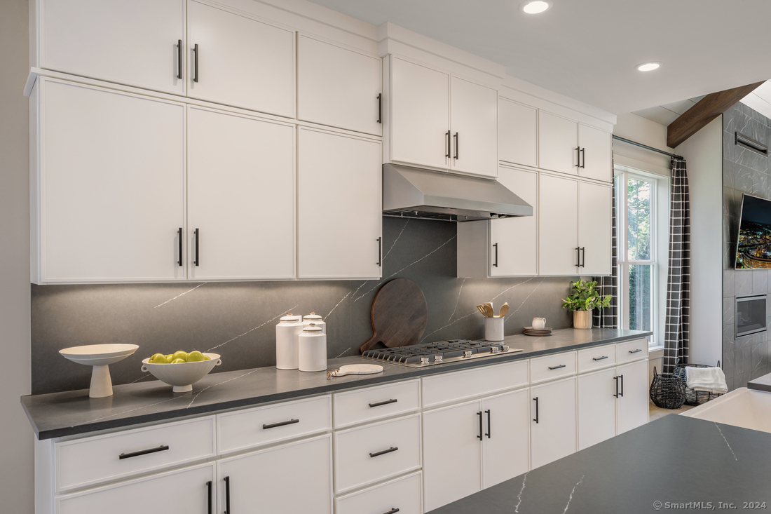 14 Whisper Rdg Way, Unit 46 Woodbridge, CT 06525 - Photo 3 of 14 a kitchen with white cabinets and white appliances