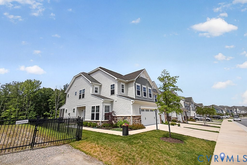 18517 Palisades Ridge Moseley, VA 23120 - Photo 41 of 55 a front view of a house with a yard