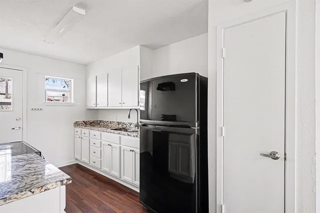 a kitchen with stainless steel appliances granite countertop a stove and a refrigerator