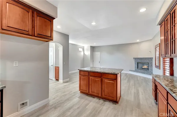 a room with wooden floors and fireplace