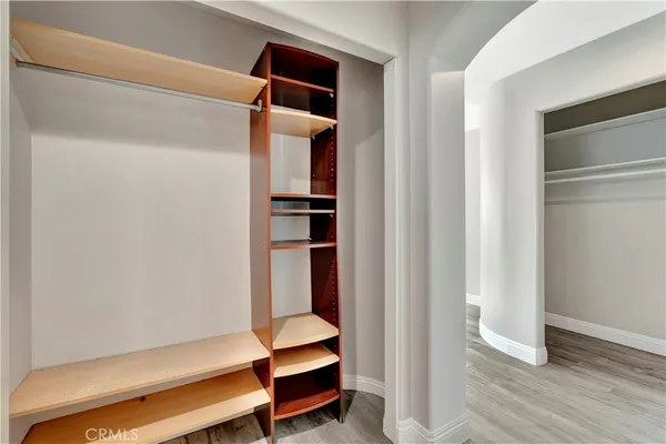 a view of room with wooden floor and closet
