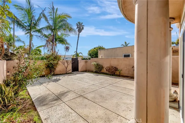 a couple of potted plants in front of door