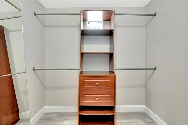 a view of walk in closet with window