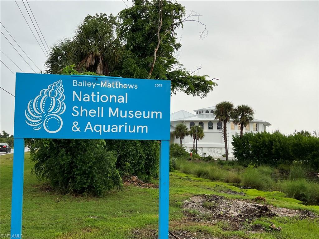 486 Ponce De Leon Road Sanibel, FL 33957 - Photo 16 of 23 a sign broad in front of the white house