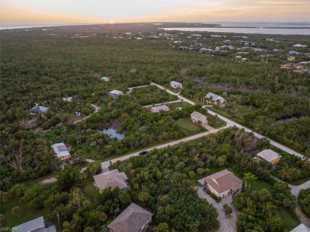 486 Ponce De Leon Road Sanibel, FL 33957 - Photo 10 of 23 an aerial view of residential house with outdoor space and trees