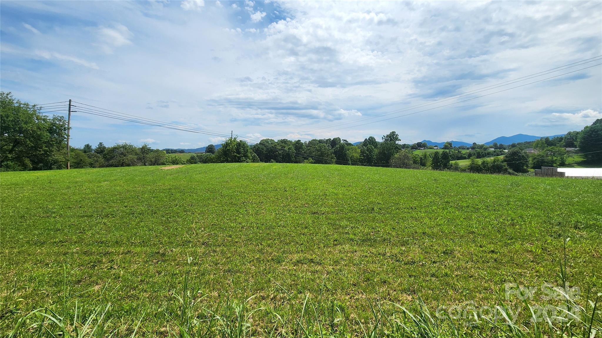 9999 Alexander Road Leicester, NC 28748 - Photo 1 of 7 a view of a field with an ocean