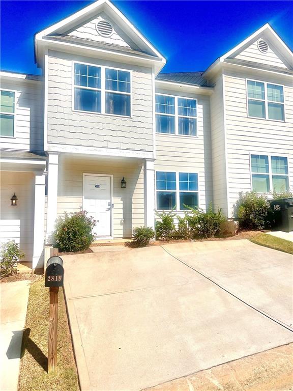 2819 Laurel Ridge Circle East Point, GA 30344 - Photo 1 of 1 a front view of a house with a yard