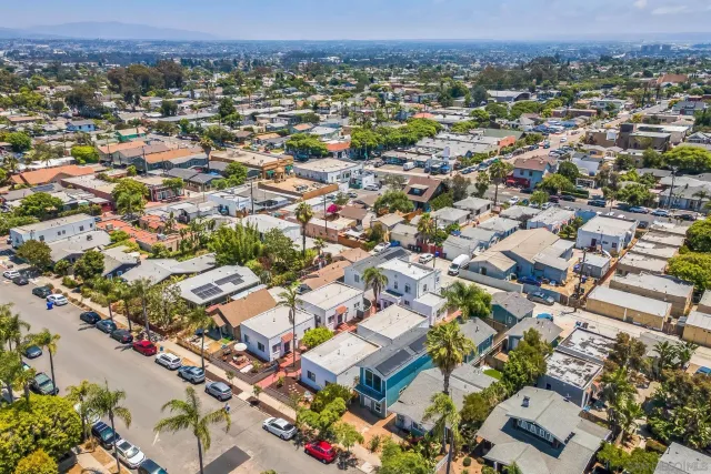 an aerial view of residential houses with outdoor space