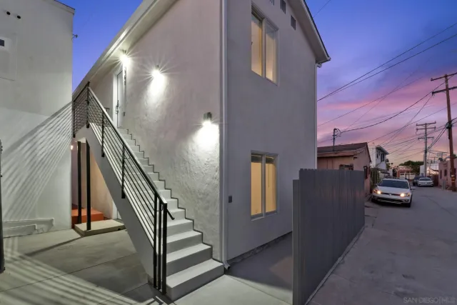 a view of a livingroom with furniture and stairs