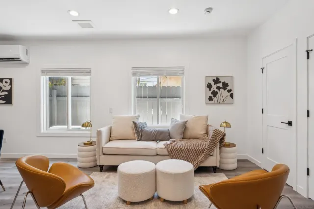 a living room with furniture and a window