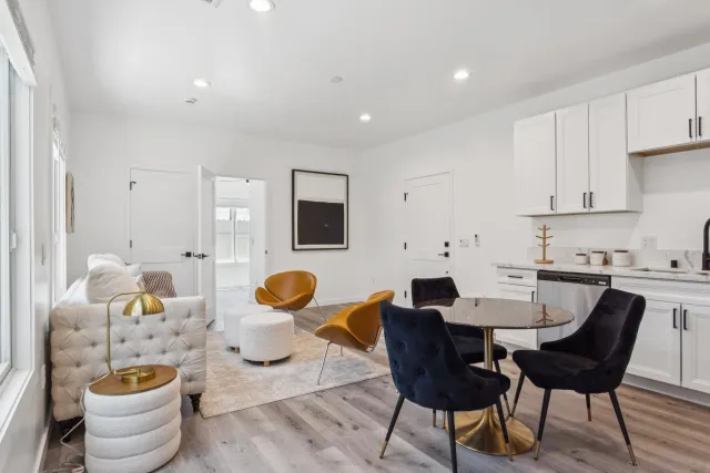 a view of a dining room with furniture and wooden floor