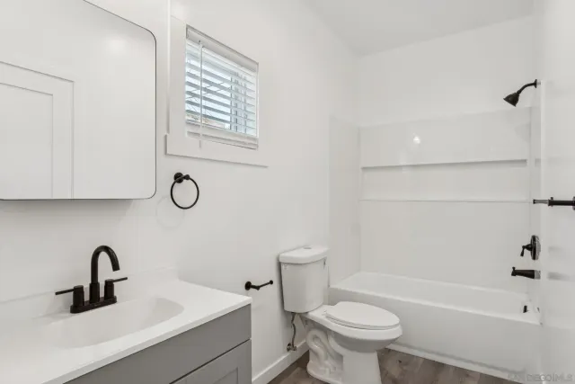 a bathroom with a sink a toilet and a bathtub