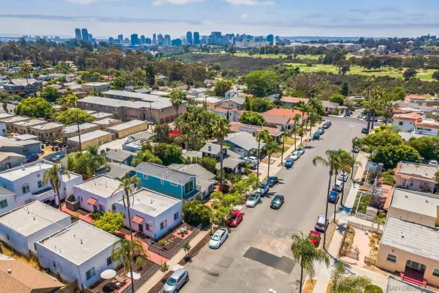 an aerial view of residential houses with outdoor space