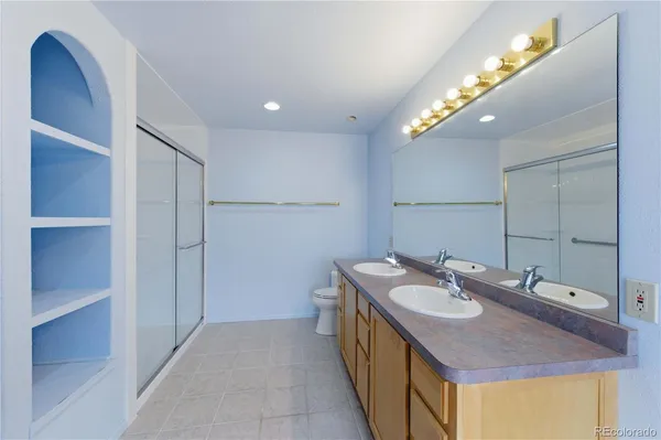 a bathroom with a sink double vanity and a mirror