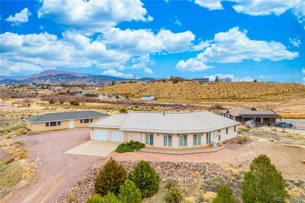 a view of a city with lawn chairs