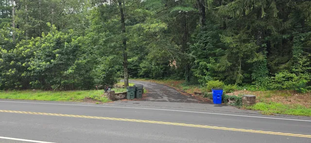 a view of a entertaining space and a car parked on the road
