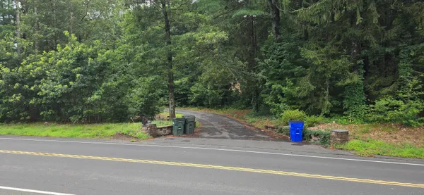 a view of a entertaining space and a car parked on the road