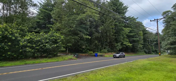 a view of street with parked cars
