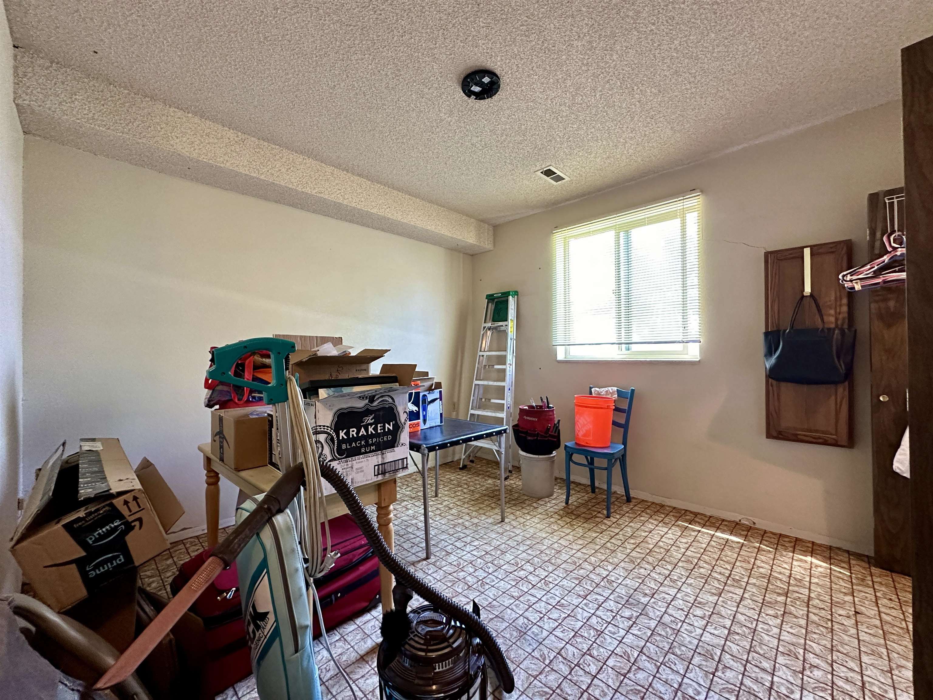 3010 F F 3/4 Road Grand Junction, CO 81504 - Photo 12 of 25 a living room with furniture a flat screen tv and a window