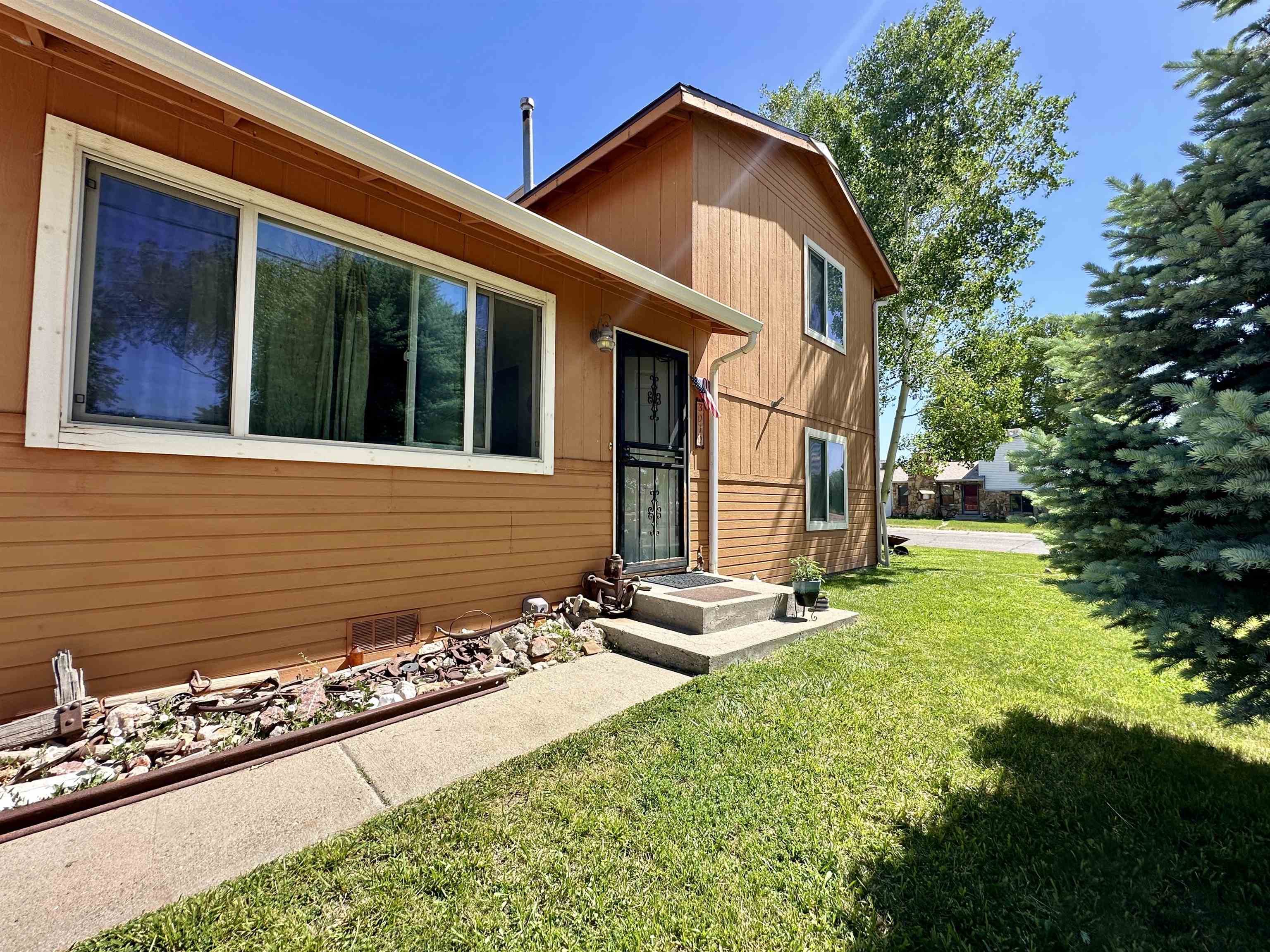 3010 F F 3/4 Road Grand Junction, CO 81504 - Photo 20 of 25 a front view of a house with garden