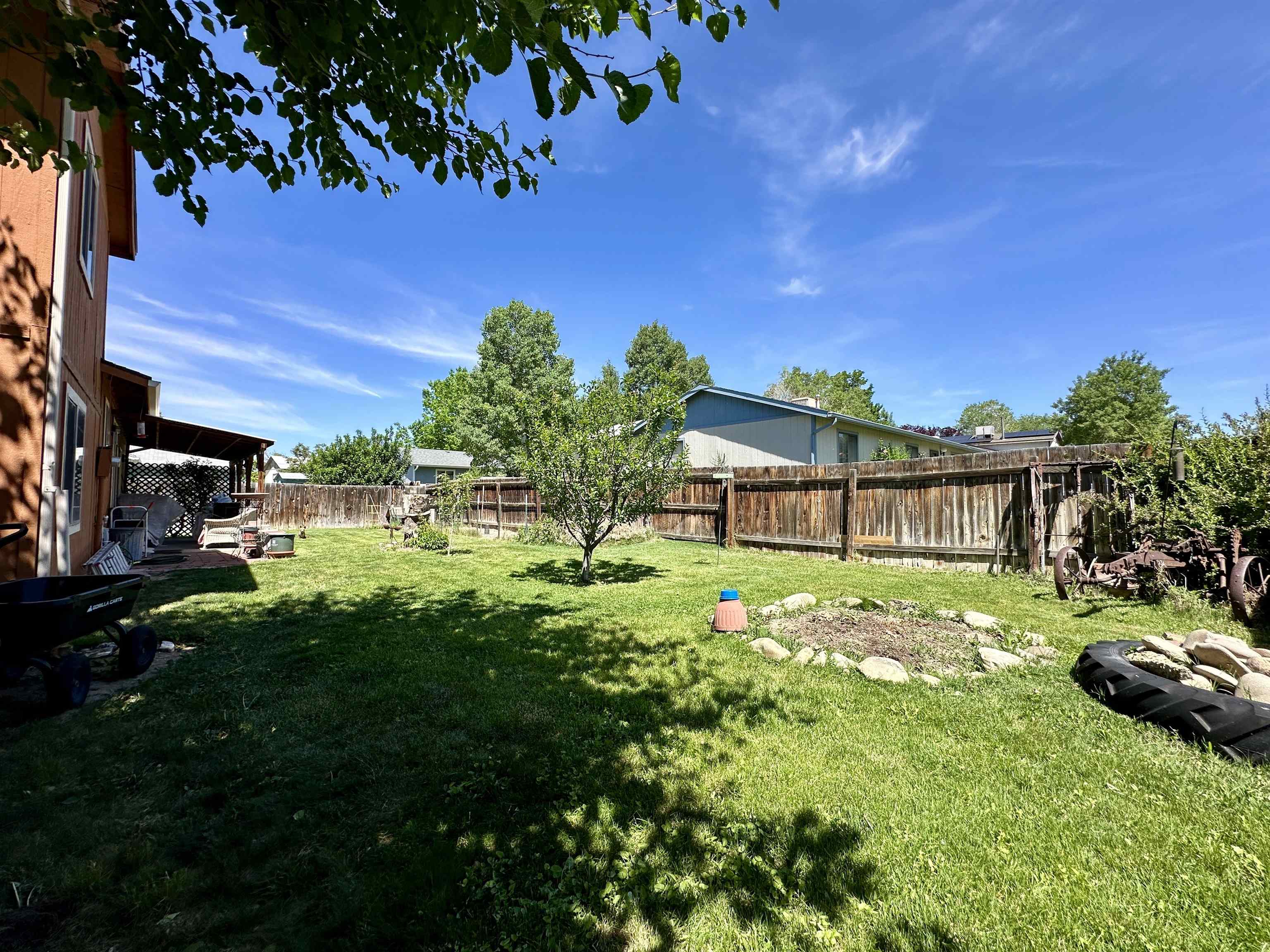 3010 F F 3/4 Road Grand Junction, CO 81504 - Photo 21 of 25 a front view of a house with a garden
