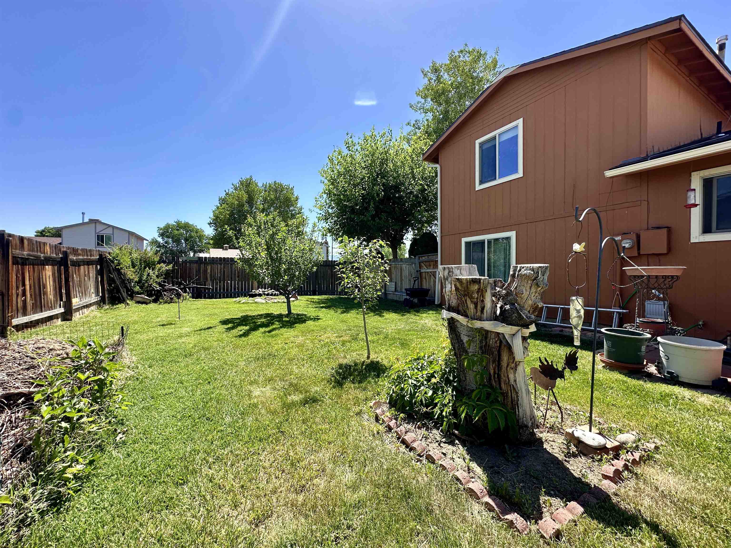 3010 F F 3/4 Road Grand Junction, CO 81504 - Photo 25 of 25 a view of a house with backyard sitting area and garden