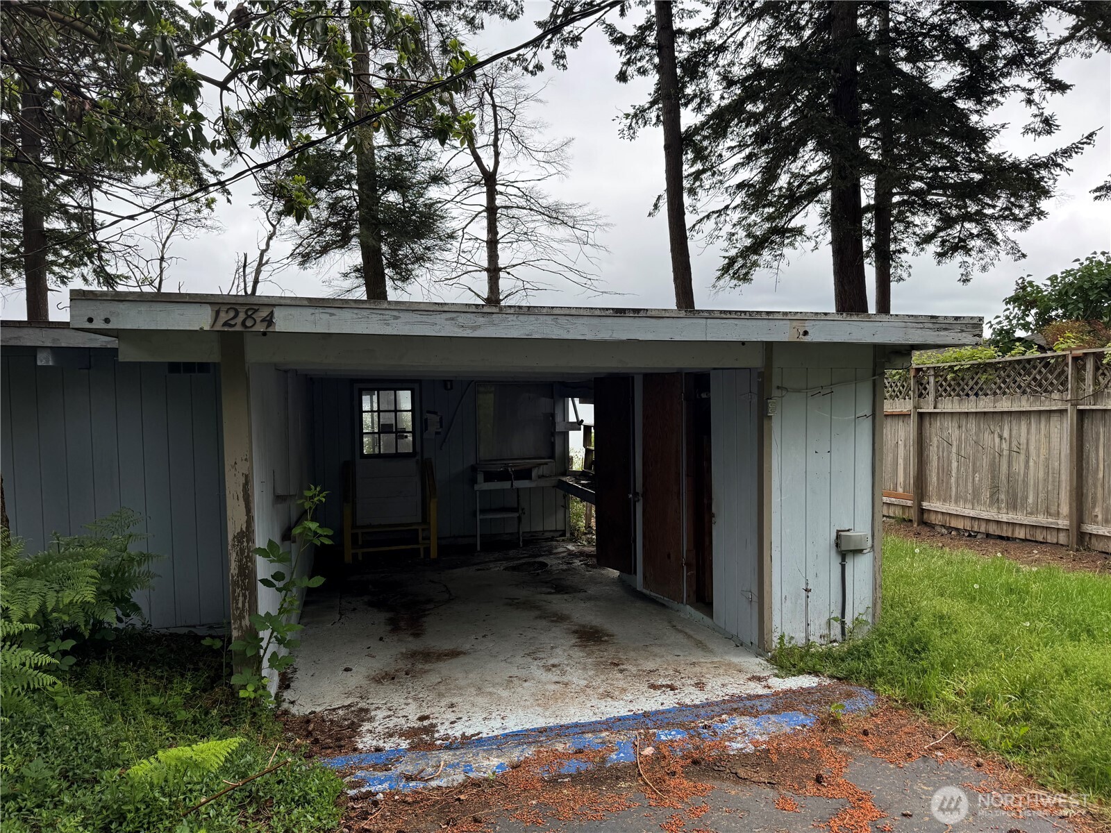 1284 Dines Point Road Greenbank, WA 98253 - Photo 26 of 39 a view of a house with a tree on the house
