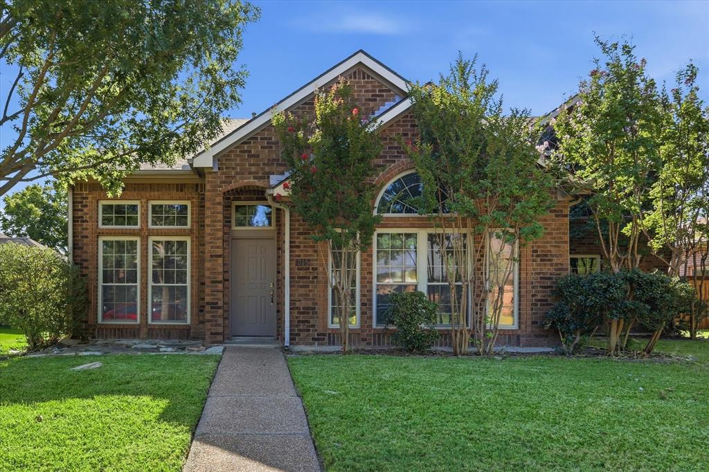 318 Lodge Road Coppell, TX 75019 - Photo 32 of 35 Distinctive rooflines, arched architectural details and abundant windows give this charming brick home timeless character.