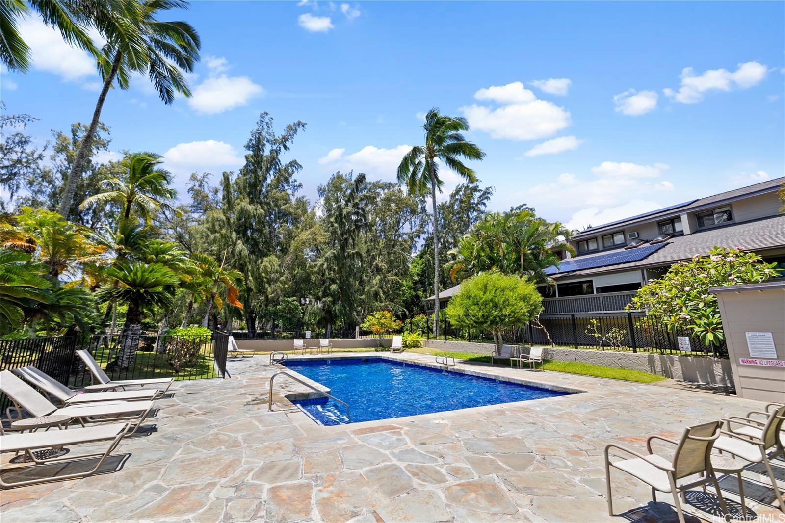 45-995 Wailele Road, Unit 35 Kaneohe, HI 96744 - Photo 23 of 25 Makani Kai Marina pool and outdoor lounge seating