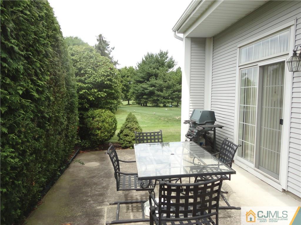29 Winthrop Road Monroe Township, NJ 08831 - Photo 2 of 25 a view of a patio with table and chairs and potted plants