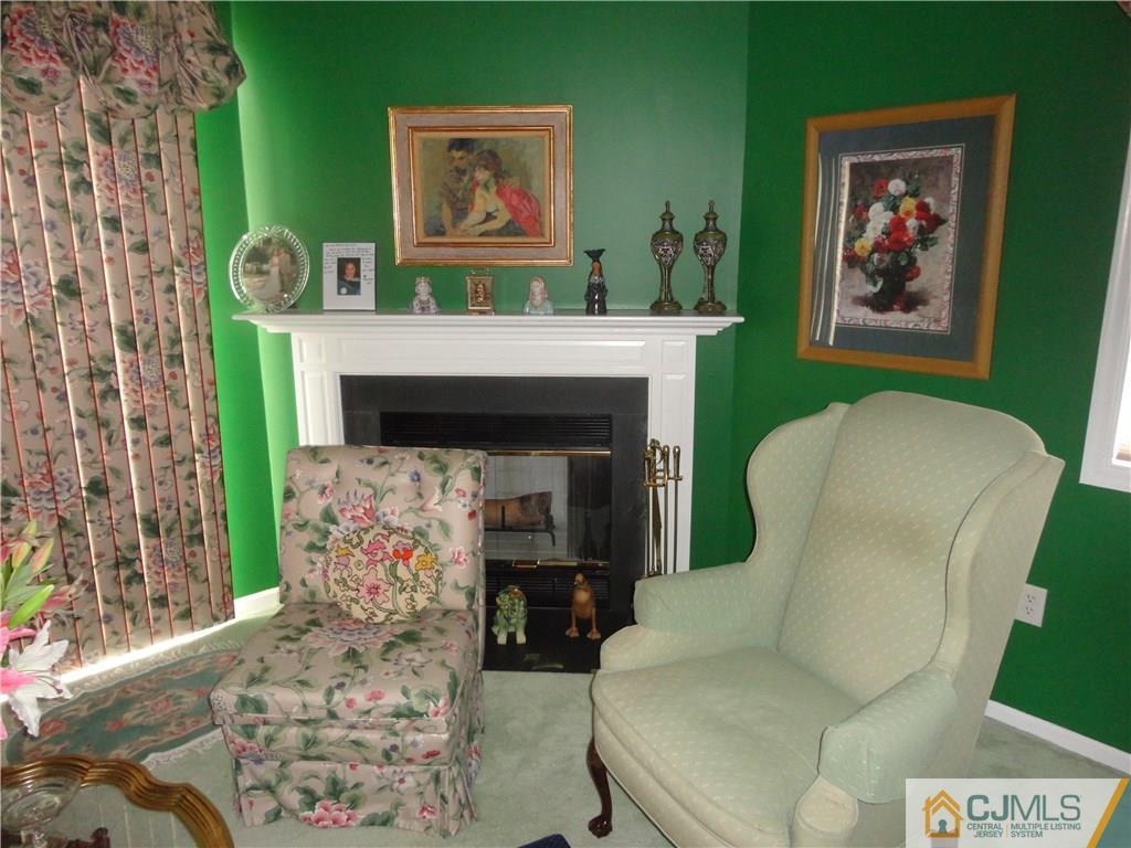 29 Winthrop Road Monroe Township, NJ 08831 - Photo 13 of 25 a living room with furniture and a fireplace