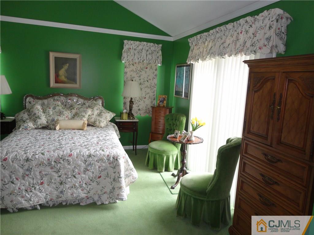 29 Winthrop Road Monroe Township, NJ 08831 - Photo 16 of 25 a bedroom with a bed dresser and a chair