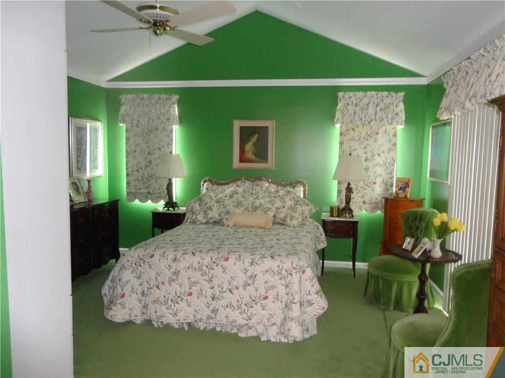 29 Winthrop Road Monroe Township, NJ 08831 - Photo 17 of 25 a living room with a bed furniture and a large window