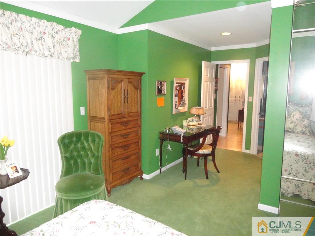 29 Winthrop Road Monroe Township, NJ 08831 - Photo 18 of 25 a living room with furniture and a table