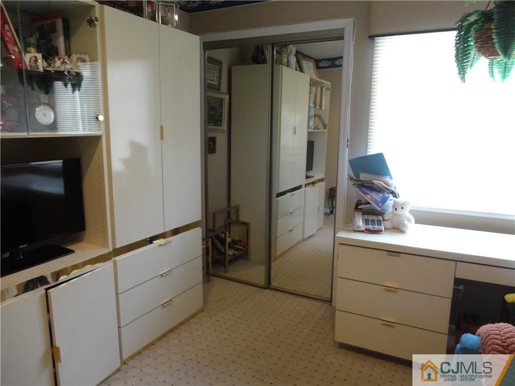 29 Winthrop Road Monroe Township, NJ 08831 - Photo 20 of 25 a kitchen with a refrigerator and a sink