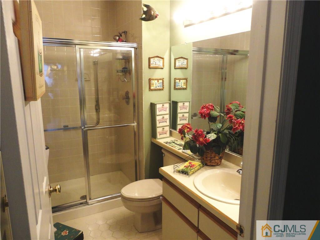 29 Winthrop Road Monroe Township, NJ 08831 - Photo 21 of 25 a bathroom with a toilet and a shower