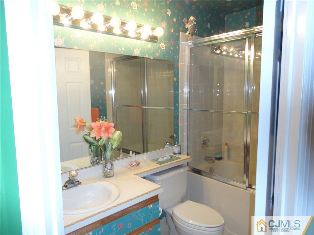29 Winthrop Road Monroe Township, NJ 08831 - Photo 22 of 25 a bathroom with a sink toilet and shower