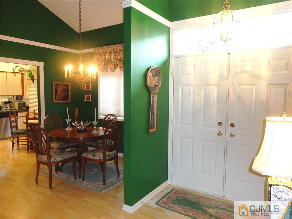 29 Winthrop Road Monroe Township, NJ 08831 - Photo 5 of 25 a view of a hallway with dining room and furniture